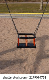 Gothenburg, Sweden - March 27 2022: Black And Orange Baby Swing At A Playground.