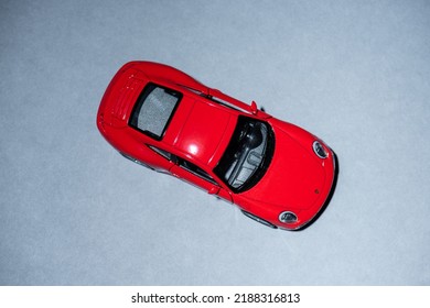 Gothenburg, Sweden - May 26 2021: Overhead View Of A Red Porsche Toy Car.