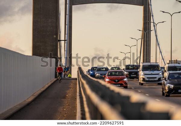Gothenburg,
Sweden - september 14 2022: Bicyclists on bike lane of a suspension
bridge along lanes of heavy car
traffic.