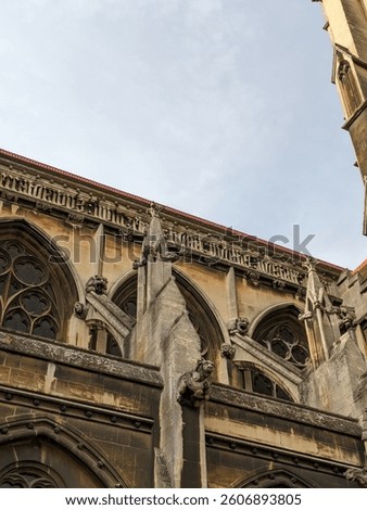 Gothic architectural details of the Church of Our Lady of the Assumption and the English Martyrs in Cambridge, showcasing intricate stone carvings and designs.