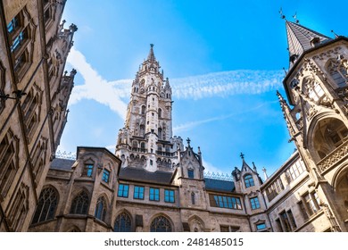 Gothic Architecture Tower with Blue Sky and Contrail in Historic European Courtyard. The New Town Hall in Munic - Powered by Shutterstock