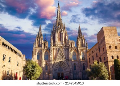 Gothic cathedral in Barcelona, Catalonia, Spain. Entrance in Barcelona Cathedral with tower. Ancient architecture of old town with medieval houses. Blue evening sky with clouds and antique street.
