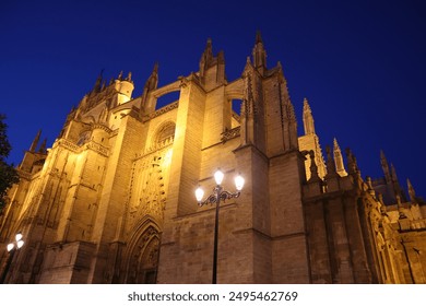 Gothic Cathedral in night time in Seville, Spain - Powered by Shutterstock