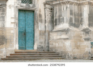 gothic church architecture facade old medieval stone walls and massive entrance door low green color - Powered by Shutterstock