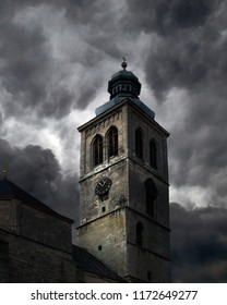 Gothic Church Tower Against The Background Of Dark Clouds