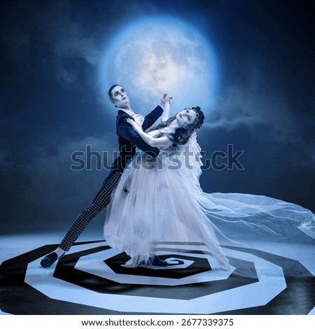 Gothic couple dancing in moonlight with dramatic pose on spiral stage. Concept of Halloween gothic fashion, dark romance, horror cinema, music cover, and avant-garde editorial.
