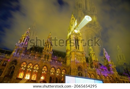 Gothic effect, double image and zoom blur effect creating erie impressionist image of town hall or Rathaus in Vienna., Austria.