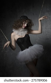 Gothic Fashion Shoot With Uncombed Brunette Wearing Like Gothic Puppet With Tutu, Bowler Hat And Clown Make-up.