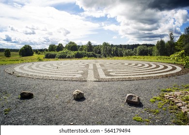 Gothic labyrinth from black and white cobble-stones in the field. Europe. Letonia. Symbol of a new way, clarification