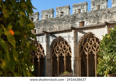Gothic ogival windows decorated with tracery in cloister of Royal Monastery of Santa Maria de Santes Creus, Aiguamurcia, Spain..