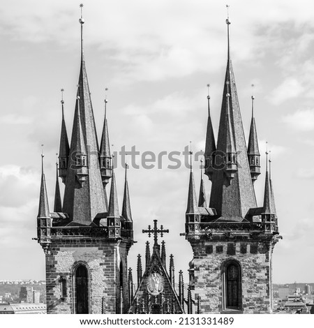 Gothic spires of Tyn Church in Prague, Czechia. Black and white photography, architectural detail