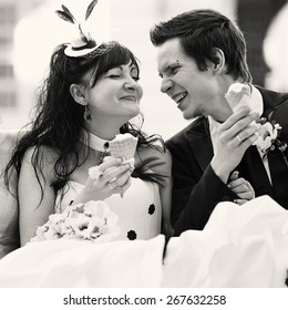  Gothic Wedding Couple Walking In Old Town. Eating Ice Cream.