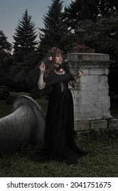 Gothic Woman In Mysterious Place, Long Black Victorian Dress Create Dramatic Atmosphere. Classic Horror Scene.