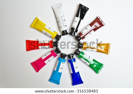 Gouache tubes set in a circular pattern. Arts, schools and education