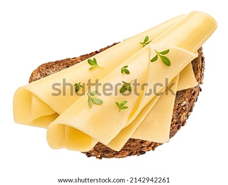 Gouda cheese slices on bread, top view