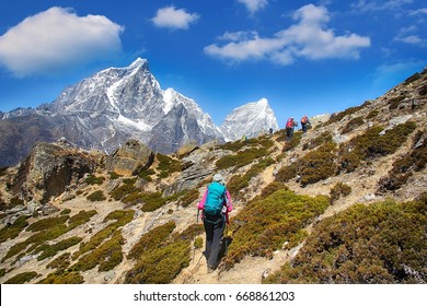 Goup of climbers in action, view on the Himalayas peak Cholatse, Nepal