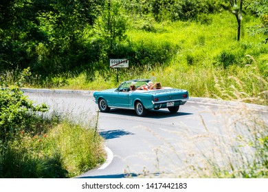 Gourdon, France - June 20, 2018. Ladies On The Road Trip In Provence In Old Blue Mustang