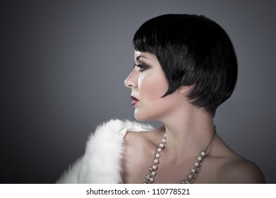 Gourgeos Female Brunette Flapper Profile Wearing Pearls And Fur, Vintage Look