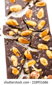 Gourmet almighty almond chocolate bar with sea salt on a white background. - Shutterstock ID 218951686