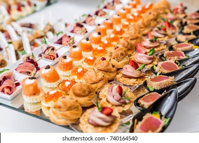 Gourmet appetizers: caviar, venison, tuna and salmon. - Shutterstock ID 740164540