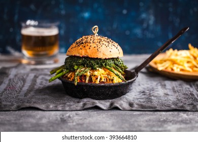 Gourmet Burger With Fermented Cabbage, Grilled Asparagus, Beetroot Dip, Bbq Beef Cutlet On Iron Pan Square Over Marble Table. Homemade Food Concept. Rustic Dark Style.