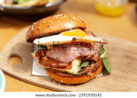 Gourmet Burger with Smoked Bacon, Avocado, and Fried Egg, an Irresistible Delight