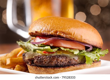 gourmet cheeseburger with mug of beer in background - Powered by Shutterstock