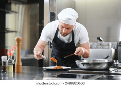 Gourmet chef in uniform cooking in a commercial kitchen. - Powered by Shutterstock