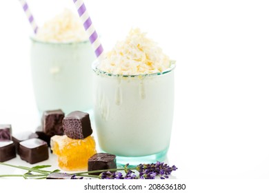 Gourmet cold honey lovender chocolate drink garnished with white chocolate. - Powered by Shutterstock