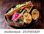 gourmet dish featuring roasted bone marrow with garnishes and toasted bread on a rustic wooden table. Ideal for culinary themes, food blogs, and restaurant promotions.