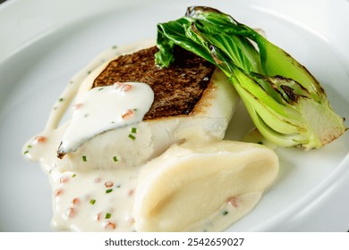 gourmet dish featuring a seared fish fillet, a smooth puree, and grilled greens, elegantly plated on a white background. Perfect for culinary presentations, restaurant menus, or food-related content. - Powered by Shutterstock