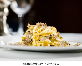 gourmet handmade pasta truffle on white plate