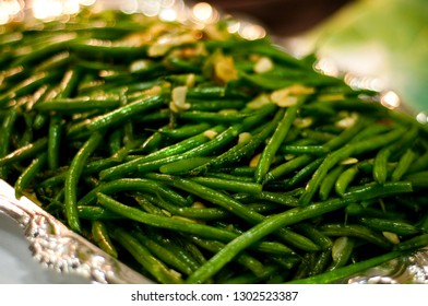 Gourmet Long Green Beans Topped With Almonds On An Elegant Buffet Serving Line