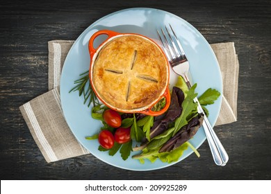 Gourmet Meat Pie With Garden Salad Served On Plate From Above