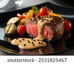 Gourmet Medium-Rare Steak with Grilled Vegetables and Creamy Peppercorn Sauce