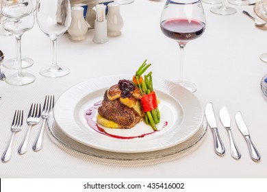 Gourmet Mixed Meat With Vegetables,  On A Classy Restaurant Table