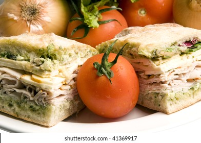 Gourmet Ovengold Roast Turkey Sandwich With Muenster Cheese Sliced Avocado Spring Mix Pesto Mayonaisse On Ciabatta Bread