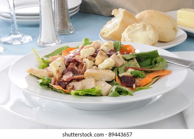 A Gourmet Salad With Bacon Bits Bleu Cheese, Chicken, Dried Cherries And Walnuts