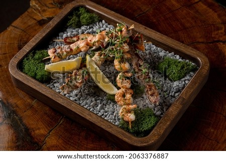 Similar – Image, Stock Photo Skewering moss on a wall stone in front of a blurred background