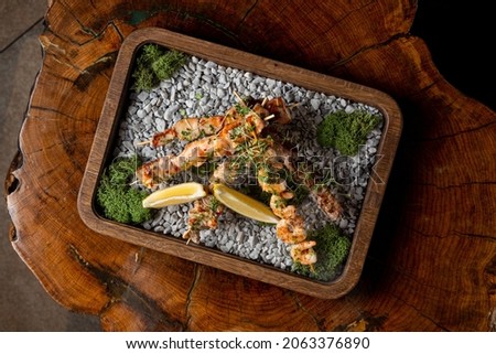Similar – Image, Stock Photo Skewering moss on a wall stone in front of a blurred background