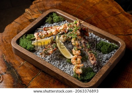 Similar – Image, Stock Photo Skewering moss on a wall stone in front of a blurred background