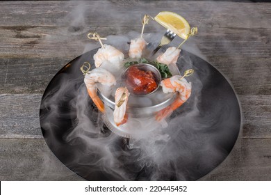 Gourmet Smoking Shrimp Cocktail Served On Dry Ice With Lemon