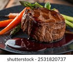 Gourmet Steak Dinner with Roasted Vegetables and Red Wine Reduction