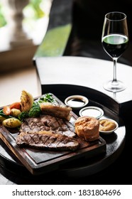 Gourmet Sunday Roast Beef Traditional British Meal Set On Old Wooden Pub Table