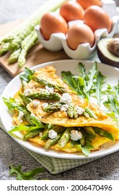 Gourmet Tasty Egg Omelette with Asparagus and soft Cheese. Asparagus. Fresh Asparagus with eggs.