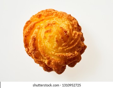 Gourmet Twirled Crispy Fried Golden Potato Cake Viewed Top Down On The Spiral Shape For A Gourmet Dinner Presentation Isolated On White