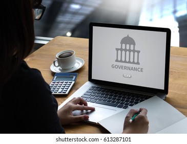GOVERNANCE and building, Authority Computing Computer Laptop with screen on table Silhouette and filter sun