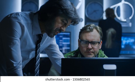 Government Chief Of Cyber Security Agent Consults Military Officer Who Works On Computer. Specialists Working On Computers In System Control Room.