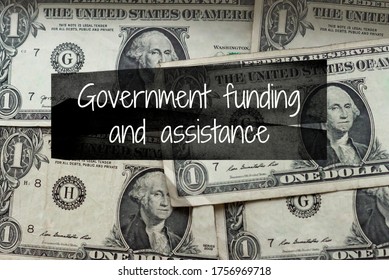 Government Funding And Assistance Advertising On Top Of American Currency, Authentic One Dollar Bills, Located In Louisiana Of The USA.