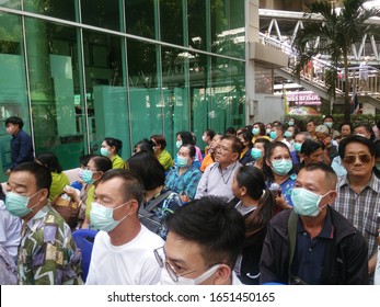 Government Pharmaceutical Organization, Bangkok, Thailand - February 20,2020. Thai People Sitting In Row For Preparing To Buy Hygienic Mask For Self Protection Covid 19 Virus Inside Building